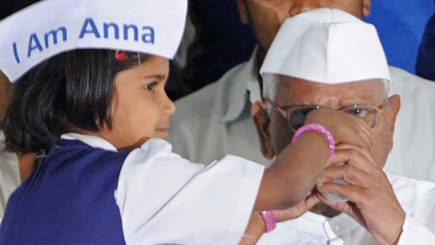 It's over ... Anna Hazare breaks his fast with a glass of juice.