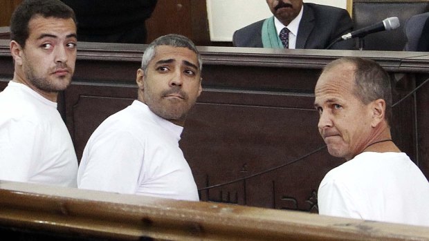 Al-Jazeera journalists Baher Mohamed, Mohamed Fahmy and Peter Greste appear in a Cairo court in March, 2014.