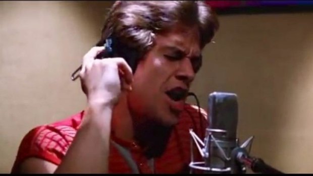 Mark Wahlberg's Dirk Diggler singing <i>The Touch</i> in the film <i>Boogie Nights.</i>