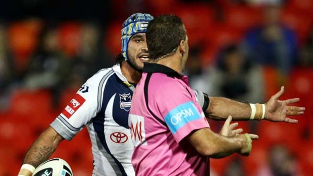 You're kidding . . . Johnathan Thurston pleads with referee Steve Lyons at Penrith last night.