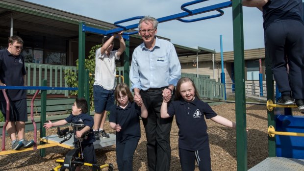 Mornington Special Developmental School acting principal David Newport with students Imogen Campbell (left) and Teleah Ledger (right). The school is riddled with asbestos and the buildings are dilapidated. 