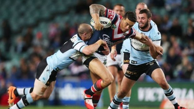 I want to break free: Sonny Bill Williams tries to evade Jeff Robson's clutches.