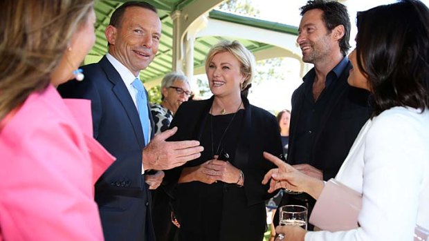 "Lottery of life": Prime Minister Tony Abbott with Deborra-Lee Furness and Hugh Jackman.