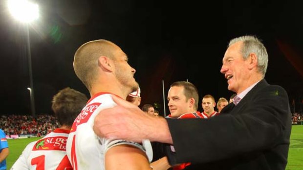 The Dragons' Matt Cooper and coach Wayne Bennett celebrate after beating South Sydney earlier this month.