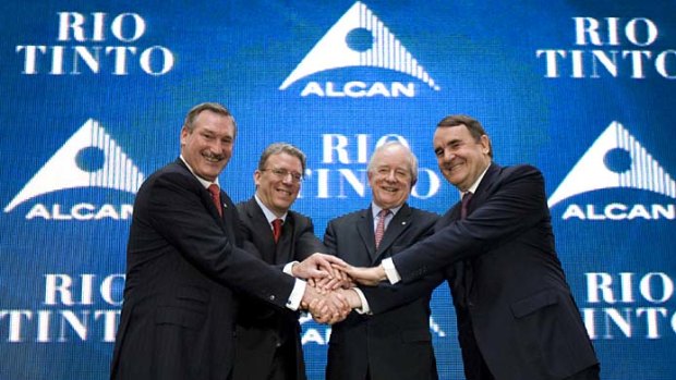 Alcan and Rio Tinto executives seal their deal.