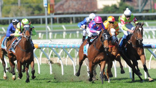 Rock'n'roll: Fast 'n' Rocking (pink cap) finishes brilliantly, if erratically, at Caulfield.