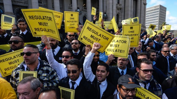 Taxi drivers protesting at Parliament House in September 2015 over the Uber X App that they say is destroying their business.
