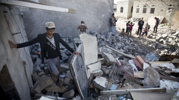 Houses destroyed by Saudi air strikes near the airport in Sanaa.