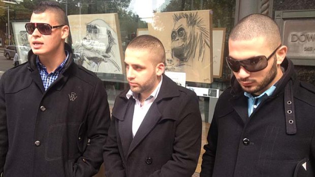 Ali Mehanna, centre, and two unnamed men outside court.