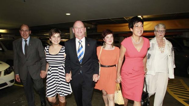 Victorious ... Campbell Newman arriving at the Hilton Hotel with his family last night.