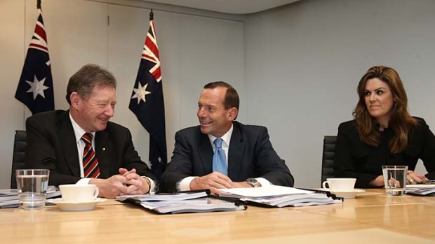 Secretary for the Department of Prime Minister and Cabinet Ian Watt with Mr Abbott and adviser Peta Credlin.