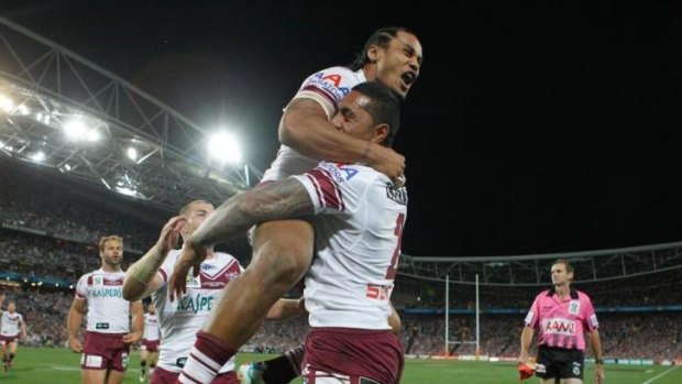 Bargain buy: Jorge Taufua, embraced by Steve Matai, celebrates scoring the opening try in Manly's grand final loss to the Roosters last year.