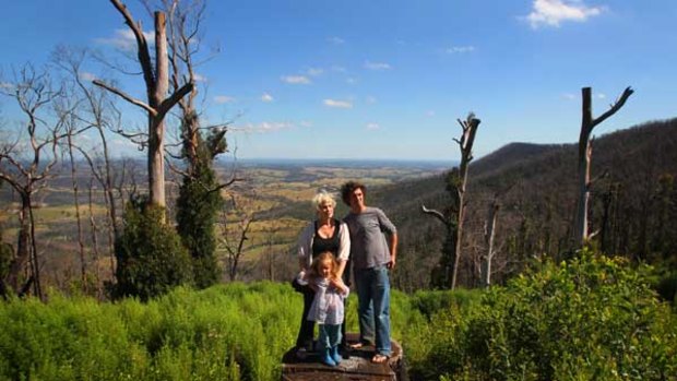 Bronwyn Milne and Finn McMaster with daughter Indigo, 4, on their property in Kinglake West.