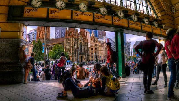 Melbourne as seen in high dynamic range photography. Every photographer's dream shot, looking out from under the Flinders Street clocks.