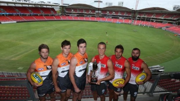 Giants players (from left to right) Callan Ward, Phil Davis and Jeremy Cameron with Swans players Ted Richards, Josh Kennedy and Rhyce Shaw.