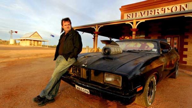 Chris Fraser outside the Silverton Hotel with his replica of Max's Interceptor.