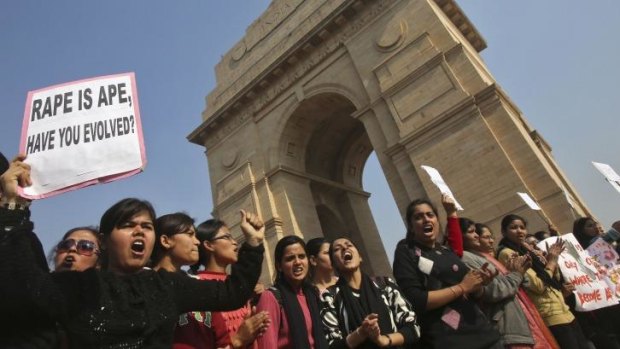 Enough is enough: Demonstrators hold placards in front of the India Gate as they protest in Delhi. 