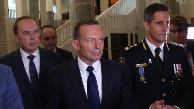 Immigration Minister Peter Dutton, Prime Minister Tony Abbott and Australian Border Force commissioner Roman Quaedvlieg.