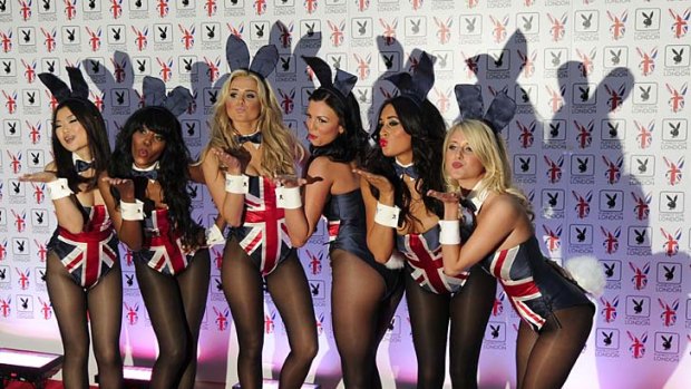 Playboy bunnies pose for photographers at the opening of the Playboy Club in central London.