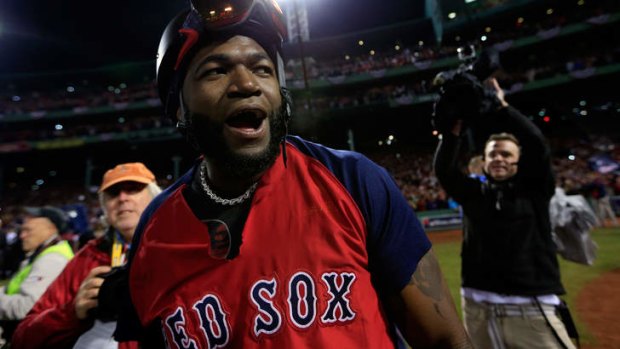 Sock it to 'em: Boston Red Sox hero David Ortiz celebrates winning game six to claim the World Series.