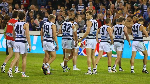 Pipped at the post: The Cats leave the field after losing to Brisbane on Sunday.