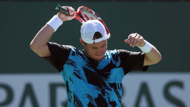 Lleyton Hewitt reacts after losing a point to Kevin Anderson at Indian Wells.