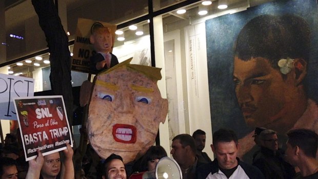 Demonstrators protest the SNL studios, protest Donald Trump's views on immigration.