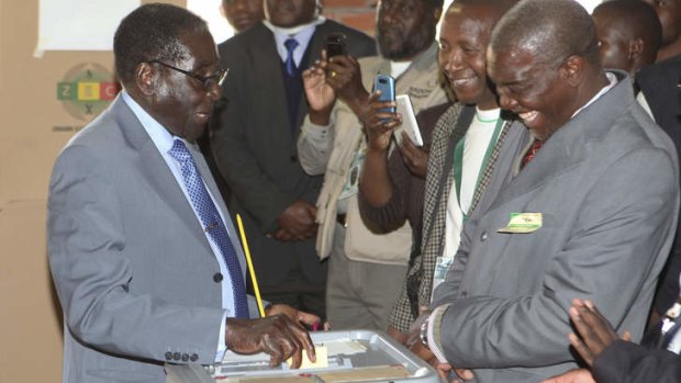 Key poll: Zimbabwean President Robert Mugabe casts his vote in Harare.