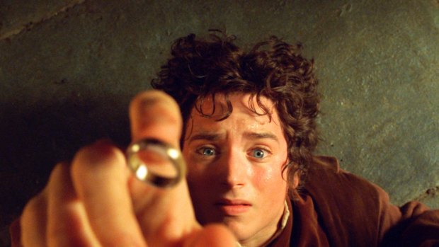 Elijah Wood's character Frodo reaches for the "One Ring", in the film the Fellowship of the Ring