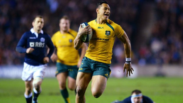 Israel Folau breaks free from Moray Low and the Scottish defence to score at Murrayfield Stadium.