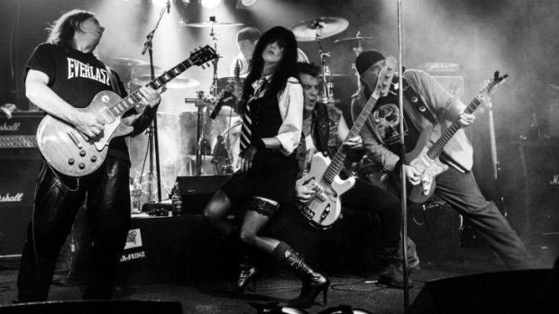 Donna Greene (centre) was performing at a Chrissy Amphlett tribute concert when her leg collapsed beneath her - a symptom of multiple sclerosis.