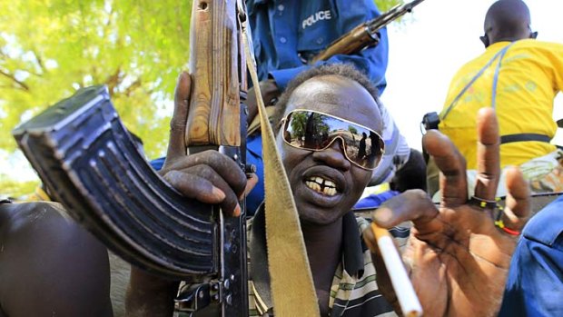 A South Sudan soldier poses in Bor, where fighting has been fierce.