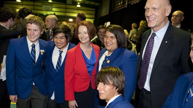Prime Minister Julia Gillard and Minister for School Education, Early Childhood and Youth Peter Garrett pose for pictures with students before the public forum.