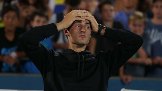 Down and out: Bernard Tomic.