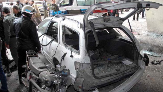 A police car damaged in the explosion in Damascus.