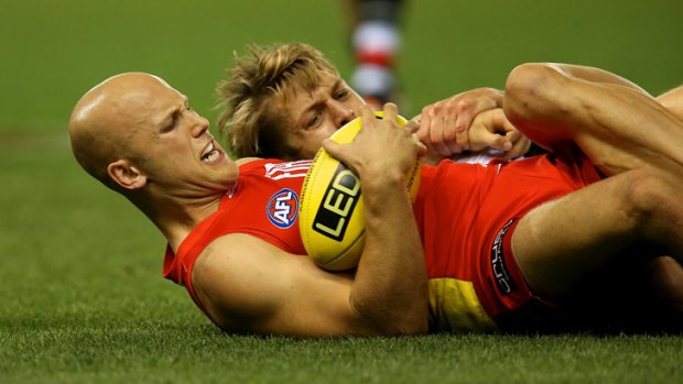 Give me a hand: Gary Ablett battles Sean Dempster of St Kilda for possession.