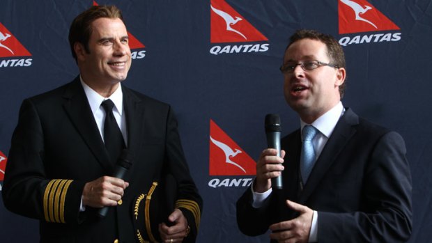 Actor John Travolta with Qantas CEO Alan Joyce at celebrations for the airline's 90th birthday.