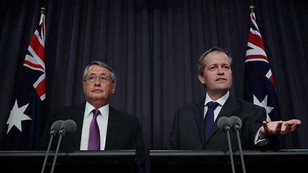 The federal government's superannuation plan is more far reaching than that forecast by Treasurer Wayne Swan (left) and the Minister for Financial Services and Superannuation, Bill Shorten.