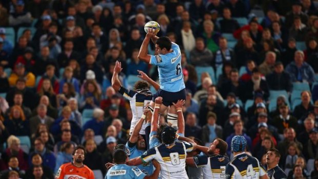 The Waratahs' Dave Dennis wins line-out ball during the round 17 Super Rugby match against the Brumbies. 
