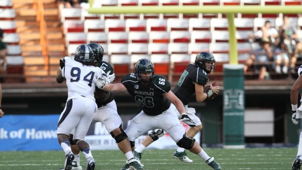 Blake Muir, wearing No.66, playing for the University of Hawaii college football team. 