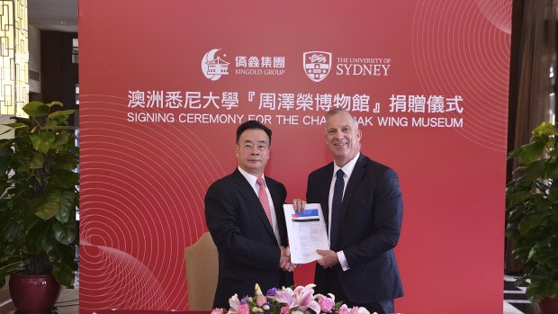 Dr Chau Chak Wing and vice-chancellor of the University of Sydney Dr Michael Spence in Guangdong, China, shaking hands on the gift to build the Chau Chak Wing Museum. 