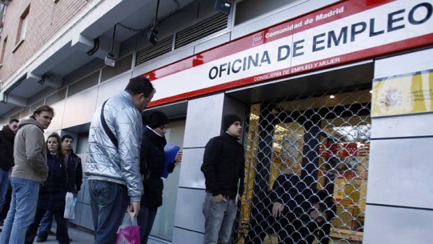 Suffering ... unemployed workers outside a government job centre in Madrid last year.