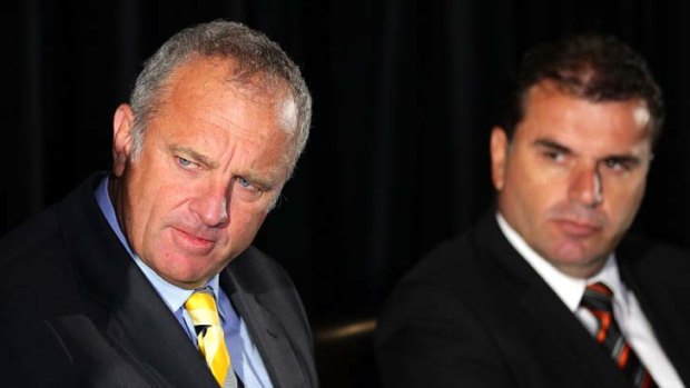 In the mix ... Graham Arnold (left), and Ange Postecoglou will be considered for the vacant Melbourne Victory coaching job.