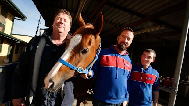 Big-hearted: Single Gaze with trainer Nick Olive, part-owner Martin Hay and foreman Billy Owen.