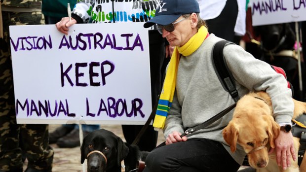 Vision-impaired workers march to Federation Square to protest at workshop closures.