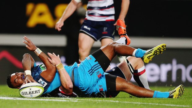 Touching down: Lolagi Visinia reaches out to score a try during the Super Rugby round 10 match between the Blues and the Melbourne Rebels at Eden Park.