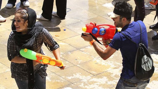 Cracking down ... 10 arrests were made after a huge flash mob water fight in Tehran in late July.