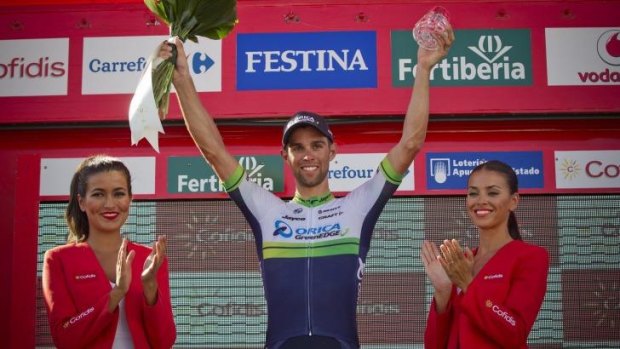 Australian rider Michael Matthews of Orica GreenEdge celebrates Monday's third stage victory on the podium.