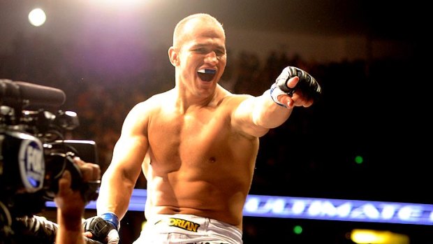 Junior dos Santos celebrates after defeating Cain Velasquez to win the UFC's heavyweight title in November, 2011. Now the former champ, dos Santos will fight Sydney's "Super Samoan" Mark Hunt at UFC 160 in May.
