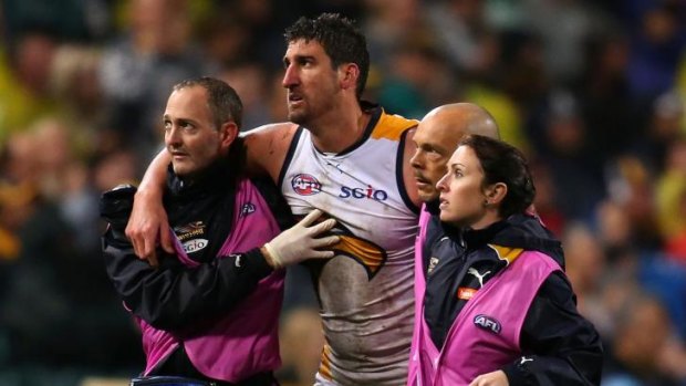 Dean Cox is helped off the ground on Friday night after being felled by Tyrone Vickery.